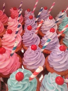 cupcakes with colorful frosting and cherry on top