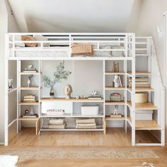 a white bunk bed sitting next to a wooden floor