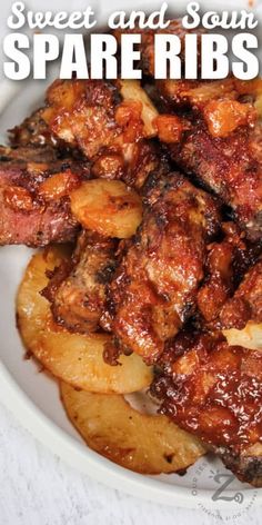 sweet and sour spare ribs with pineapples in a white bowl on a table