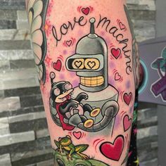 a person with a tattoo on their leg that says love machine and is holding a small dog