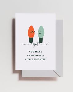 a christmas card with two lights on it and the words you make christmas a little brighter