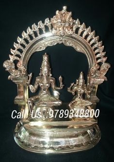 a silver plate with an ornate design on the front and sides, sitting on a black background