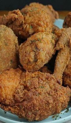 some fried food on a blue and white plate