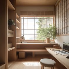 a desk with a laptop on it in front of a window that is open to the outside