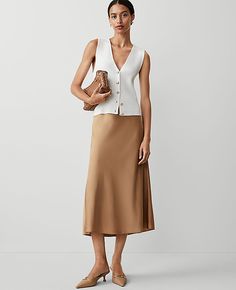 Our bias slip skirt flatters in a softly flared pull-on silhouette. Elasticized waist. Lined.,Hit:Hits at mid-calf,Imported:Imported,Length:29" long,Fabrication:100% Polyester,Garment Care:Machine Washable Petite Bias Midi Slip Skirt by Ann Taylor Size petite - XS Perfect Camel Women's A-Line, Skirts, 100%, Polyester, Machine, Washable Camel Skirt Outfit, Early Fall Fashion, Midi Slip Skirt, Fashion Trend Report, Skirt Petite, Satin Slip Skirt, Fall Fashion Skirts, Ann Taylor Petite, Business Skirt