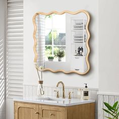 a bathroom with a sink, mirror and window