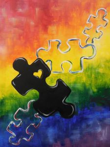 a piece of puzzle sitting on top of a painting