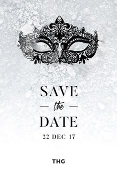 save the date card with a masquerade mask on it and an ornate design