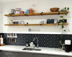 the kitchen counter is clean and ready to be used for cooking or baking, as well as shelves with pots and pans on them