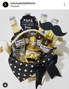 a gift basket filled with liquor bottles and condiments for a man's birthday