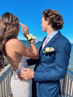 couple prom water Navy Suit Prom Couple, White Dress Prom Couple, Winter Formal Couple Pictures, White Prom Dress Couple Pictures, Prom Couples Blue, Bf And Gf Prom Pictures, Short White Prom Dress, Light Blue Prom Dress Couple Pictures, Prom Pics Inspo With Boyfriend