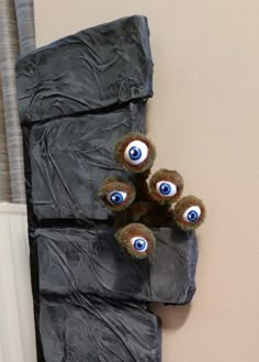 there are stuffed animals with eyes on the wall