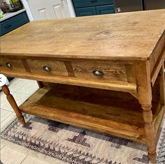 a wooden table with two drawers on it