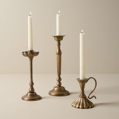 three candles are sitting next to each other