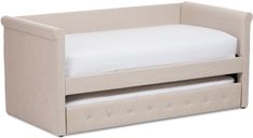 a small bed with a white pillow on it's bottom and two drawers underneath