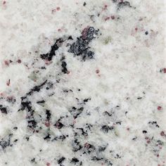 an image of white marble with red and black speckles