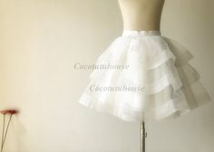 Custom Made(your own size, your preferred color, even your own design). Ivory Cupcake Tulle Skirt Three Tiered Horse Hair Tulle Skirt Other horse hair skirt for your reference, https://www.etsy.com/listing/211663905/black-tulle-skirthorse-hair-tulle?ref=listing-shop-header-1 Elastic waistband which is easy to fit different waist size. But also i can make it with satin waistband and zipper. High quality bridal tulle skirt with bridal satin lining. The listed skirt is mean to hit your knee but alw Elegant Crinoline Petticoat For Party, Spring Wedding Mini Skirt, Spring Wedding Ruffled Petticoat, Spring Wedding Petticoat With Ruffled Skirt, Spring Wedding Petticoat With Ruffles, White Full Skirt Petticoat For Party, Fitted Ruffled Wedding Petticoat, Wedding Petticoat With Ruffled Skirt And Fitted Design, Elegant Fitted Mini Skirt Petticoat