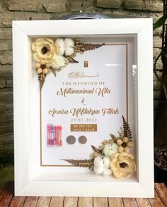 a white frame with some flowers on it