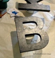 the letter b is made out of metal