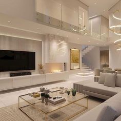 a living room with couches, tables and a television on the wall in it