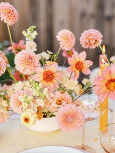 a table topped with pink and white flowers