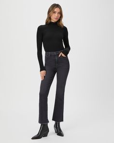 This black long sleeve high neck top is made from an incredibly soft and comfortable ribbed knit material with a flattering stitch detail at the waistline. Pair the Raisa Top with any shade of denim in your closet. Black Denim Jeans Outfit, Petite Flare Jeans, High Neck Long Sleeve Top, Denim Jeans Outfit, Black Flare Jeans, All Black Outfits, Breaking In, Soft Jeans, Cropped Flare Jeans