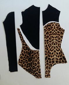 cut out pieces of clothing with black and brown animal print on them, including one top