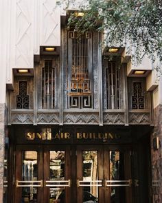 the entrance to an art deco style building