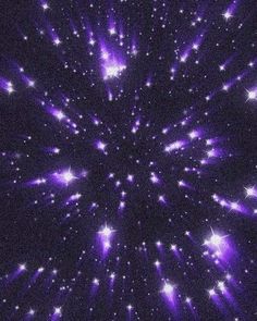 purple and white fireworks in the night sky with stars all around it, forming a starburst