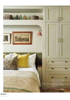 an image of a bedroom setting with white furniture and yellow pillows on the bedspread