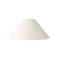 a white lamp shade is shown against a white background with the light on it's side