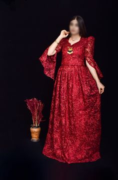 This stunning wine red Kurdish dress, featuring intricate floral embroidery and shimmering sequins, is the perfect choice for weddings, cultural events, and formal gatherings. The dress is designed with a flattering silhouette and detailed craftsmanship, showcasing the beauty of traditional Kurdish attire with a modern twist. The lace sleeves and delicate embellishments add an extra touch of elegance. *Material: Chiffon with sequins and floral embroidery *Size: Available in small size  *Care Ins Festive Anarkali Evening Dress With Resham Embroidery, Festive Evening Dress With Resham Embroidery, Festive V-neck Gown For Eid, Festive Embroidered Evening Dress For Reception, Festive V-neck Wedding Dress, Sequin V-neck Dress For Reception, V-neck Sequin Dress For Reception, Embroidered Maxi Evening Dress For Reception, Party Evening Dress With Resham Embroidery