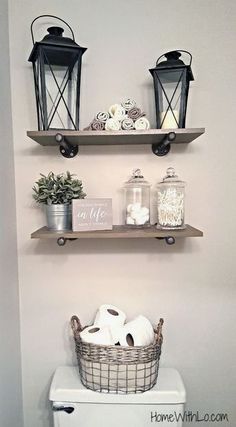 two shelves above a toilet in a bathroom