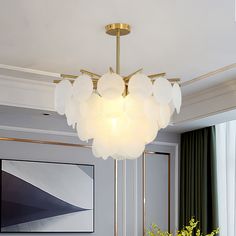 a chandelier hanging over a dining room table