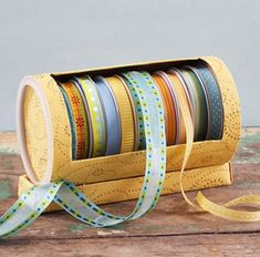 a stack of washi tapes sitting on top of a wooden table