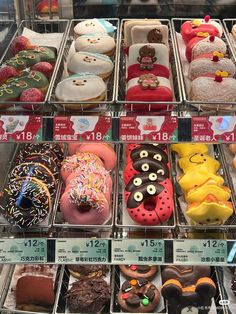 a display case filled with lots of different kinds of donuts