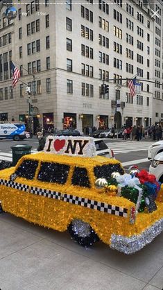 a taxi decorated with flowers and decorations on the street