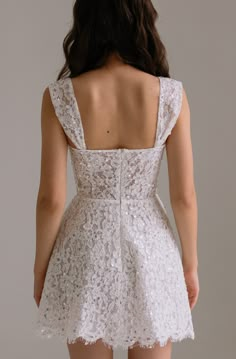 the back of a woman's white dress