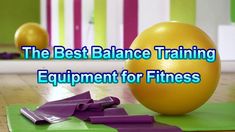 the best balance training equipment for fitness is an exercise ball and purple handles on a green mat