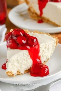 a slice of cheesecake with cherries on top