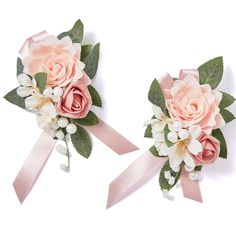 two bouquets of pink roses and white flowers with green leaves on the ends are tied together