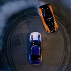 two cars are shown in the middle of a track