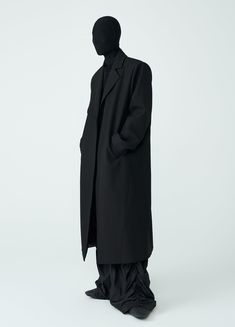 Discover the ultimate in style and comfort with The Shadow Overcoat. This unisex, loose-fitting overcoat features padded boxy shoulders and an oversized design. Made from a blend of wool, cotton, and polyester, it offers a minimal aesthetic without buttons. The wind-resistant material makes it perfect for autumn and winter. Available in black and in sizes Small to Extra Large. Size Chart: Size (CM) Length Sleeve Chest Shoulder Small 119 62.5 102 47 Medium 122 64 106 48 Large 125 65.5 110 49 Extr Oversized Solid Wool Outerwear, Oversized Solid Wool Coat For Business, Oversized Solid Single Breasted Wool Coat, Oversized Solid Single-breasted Wool Coat, Classic Long Oversized Wool Coat, Classic Oversized Long Wool Coat, Oversized Long Classic Wool Coat, Oversized Solid Wool Coat For Work, Oversized Wool Coat For Business