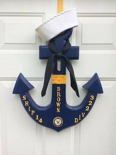 an anchor with a sailor's hat hanging on the door