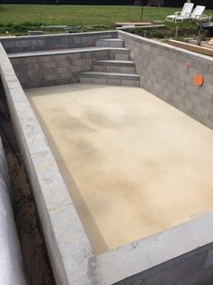 a concrete pool being built with steps leading up to it