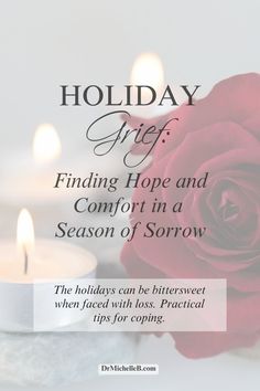 a red rose sitting on top of a table next to two candles with the words holiday gift