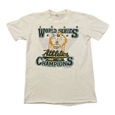 Vintage 1988 World Series Champions Oakland Athletics T-Shirt Adult Medium To purchase go to Vintage Sports Shirt, Vintage Graphic T-shirt For Sports Events, Vintage Graphic Print T-shirt For Sports Events, Vintage College Shirts, College Shirt Design, Vintage Sports T-shirt With Logo Print, Vintage T-shirt For Baseball Season, Merch Shoot, World Series Shirts