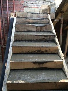 some steps that have been made out of concrete and are being used as a stair case