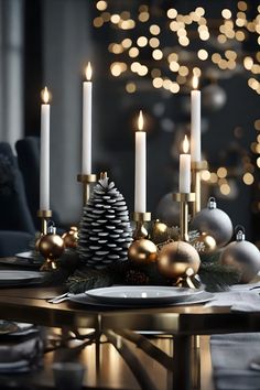 a christmas table setting with candles and ornaments