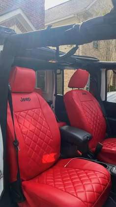 the interior of a white truck with red leather seats and black piping on it